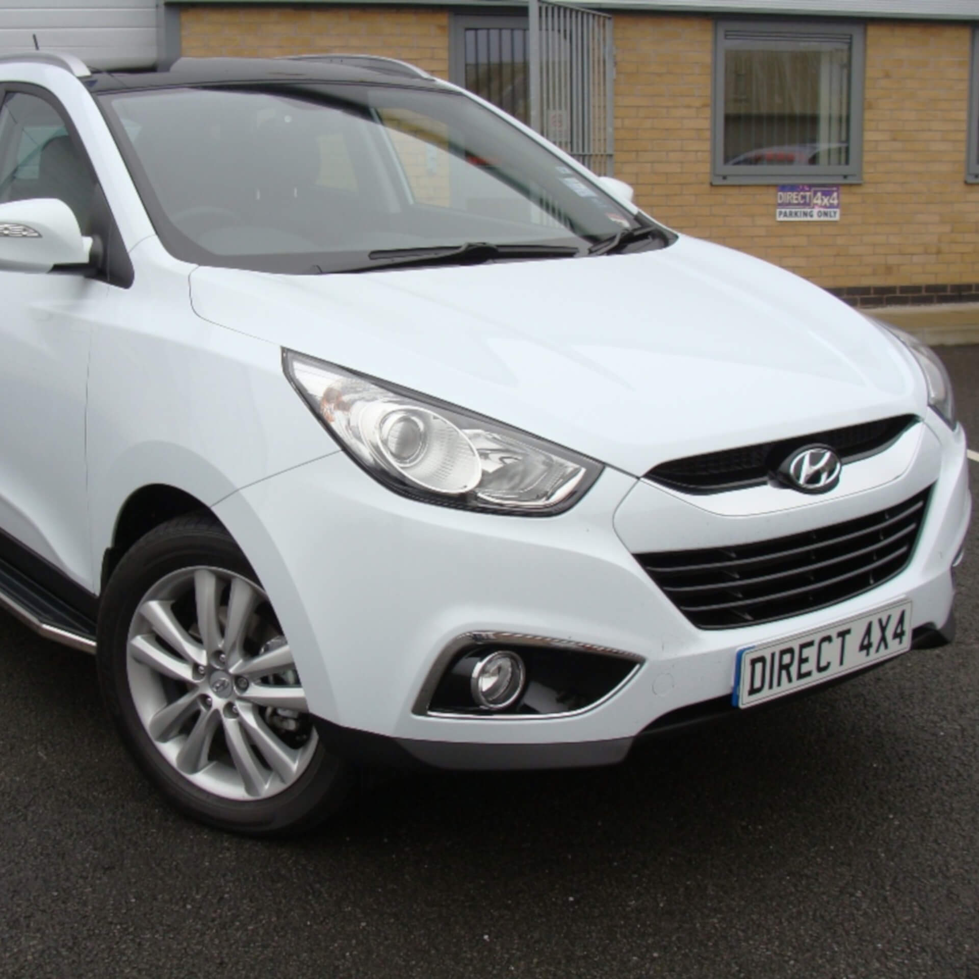 Direct4x4 accessories for Hyundai IX35 vehicles with a photo of a white Hyundai IX35 with our raptor side steps fitted outside our office
