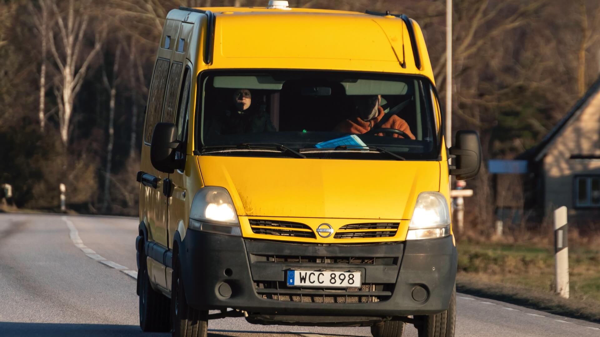 Photo of a yellow Nissan Insterstar van being driven on a European road