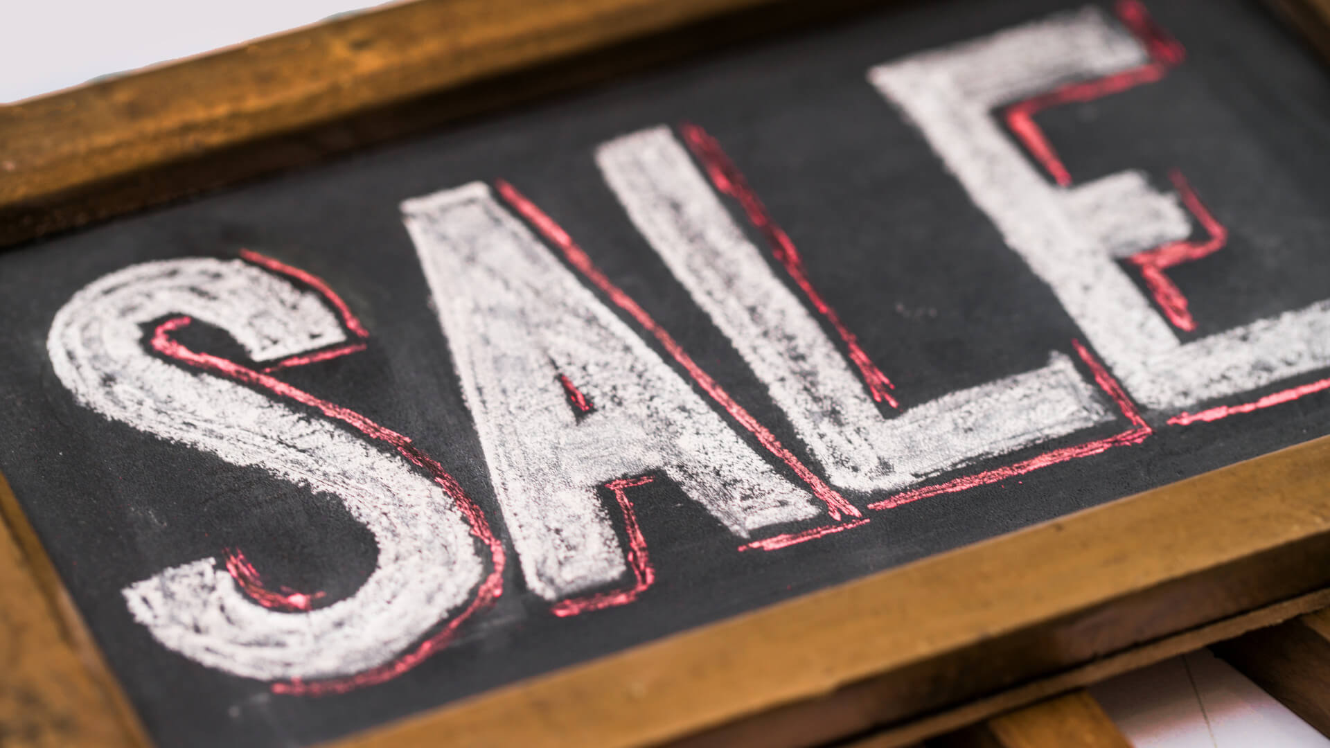 Direct4x4 On Sale and clearance accessories with "Sale" on a wooden framed chalk board.