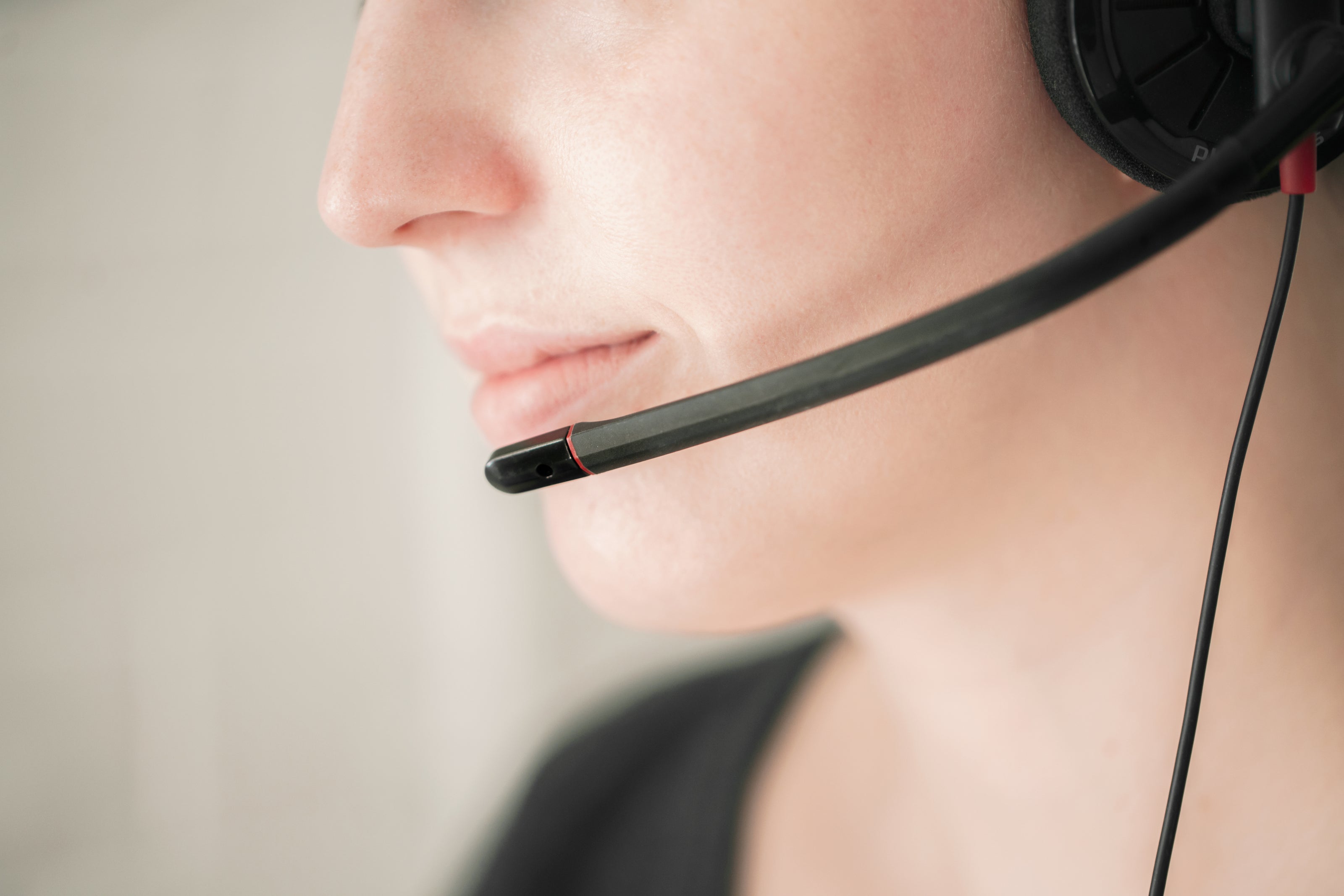 Female customer support agent with a headset on.