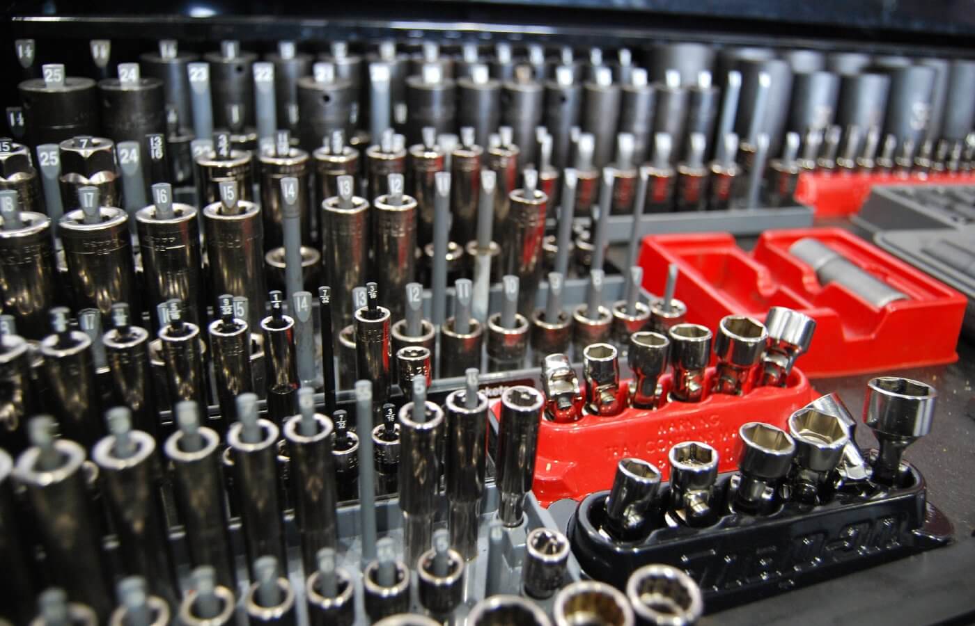 Direct4x4 expert mechanic fitting service page using a close-up photo of many different wrench sockets and other tools