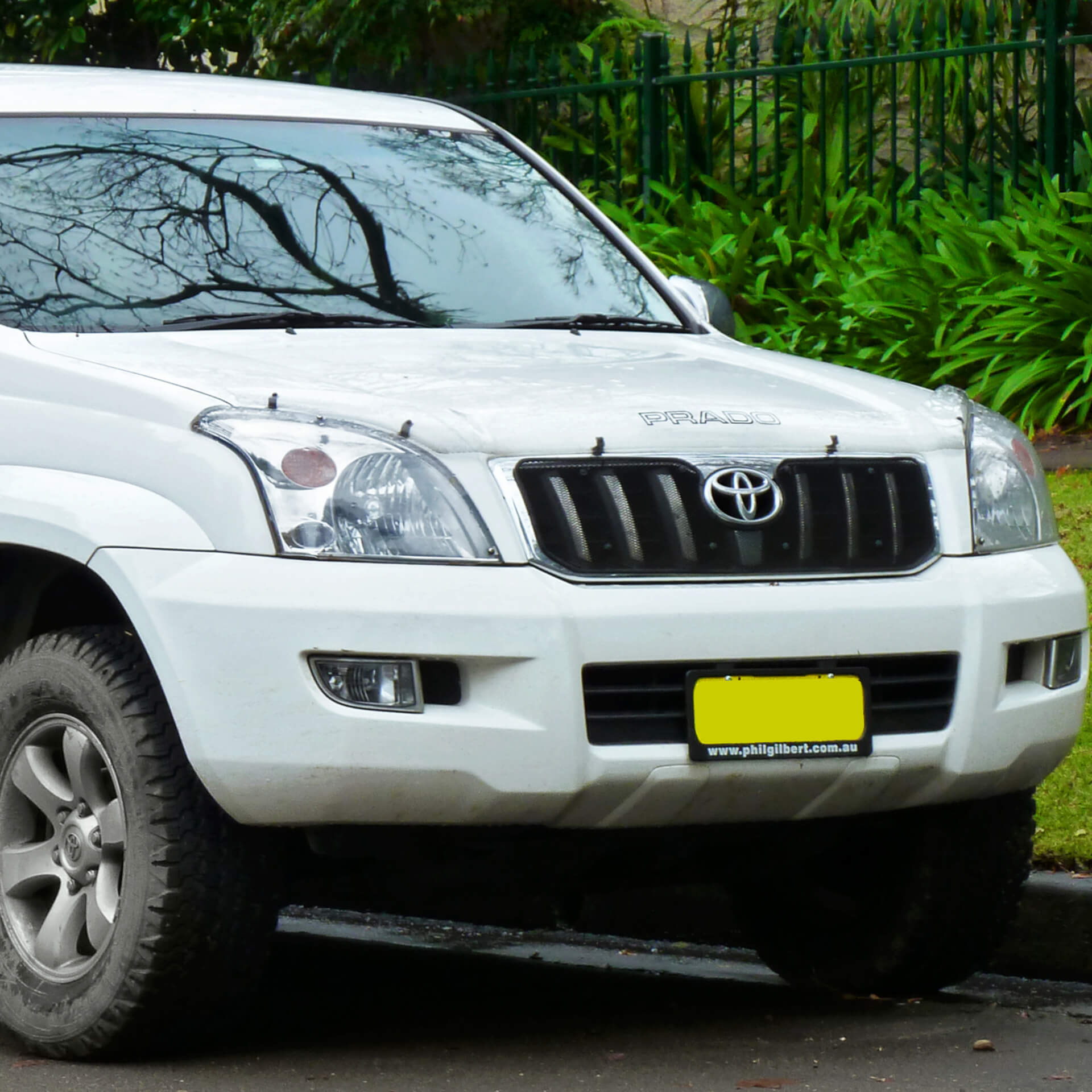 Direct4x4 accessories for Toyota Land Cruiser vehicles with a photo of the front of a white Toyota Land Cruiser parked by a grass verge