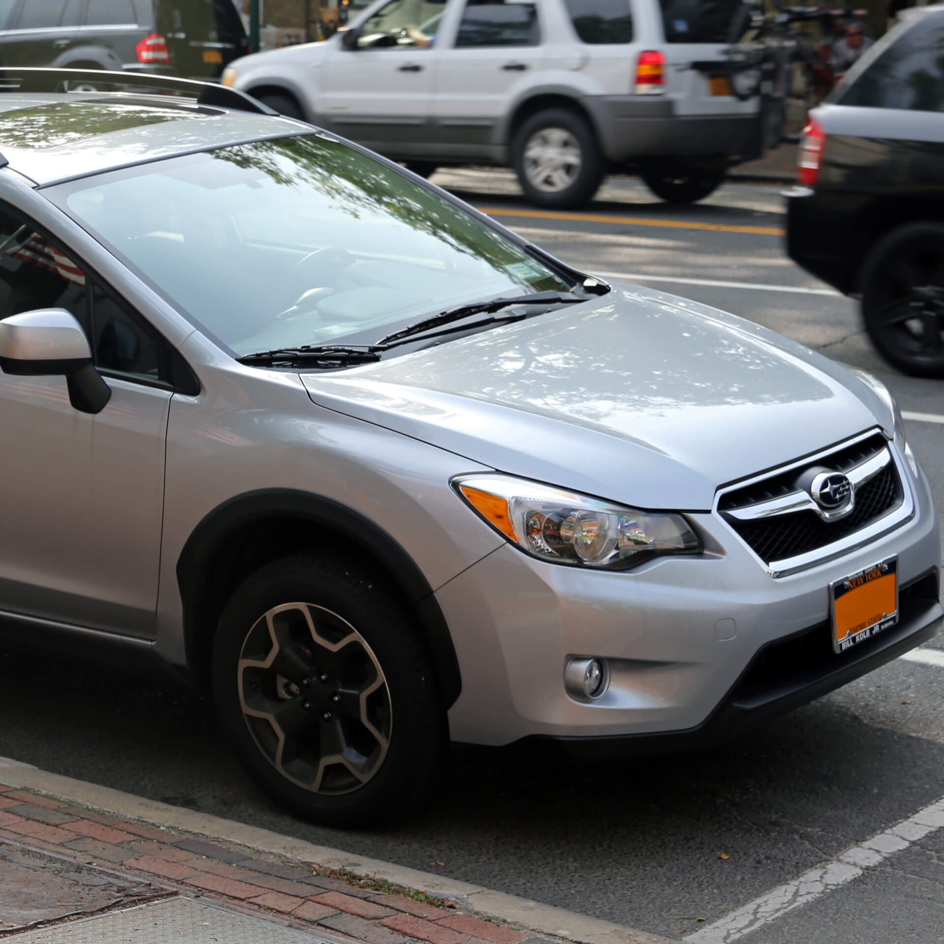 Direct4x4 accessories for Subaru XV vehicles with a photo of a silver Subaru XV parked at the side of a busy road
