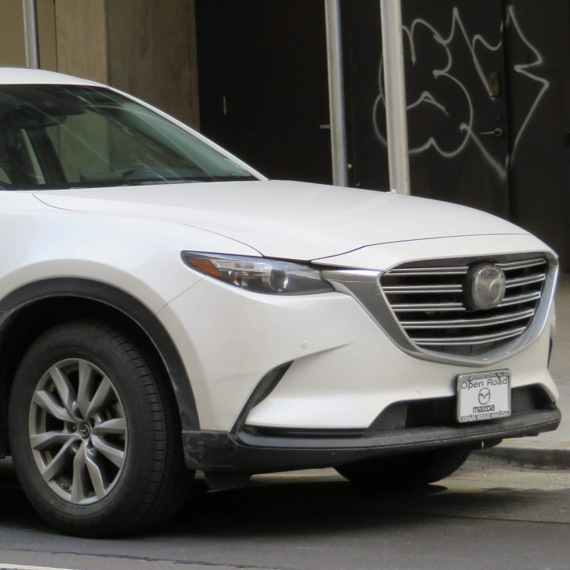 Direct4x4 accessories for Mazda CX-9 vehicles with a photo of the front of a white Mazda CX-9