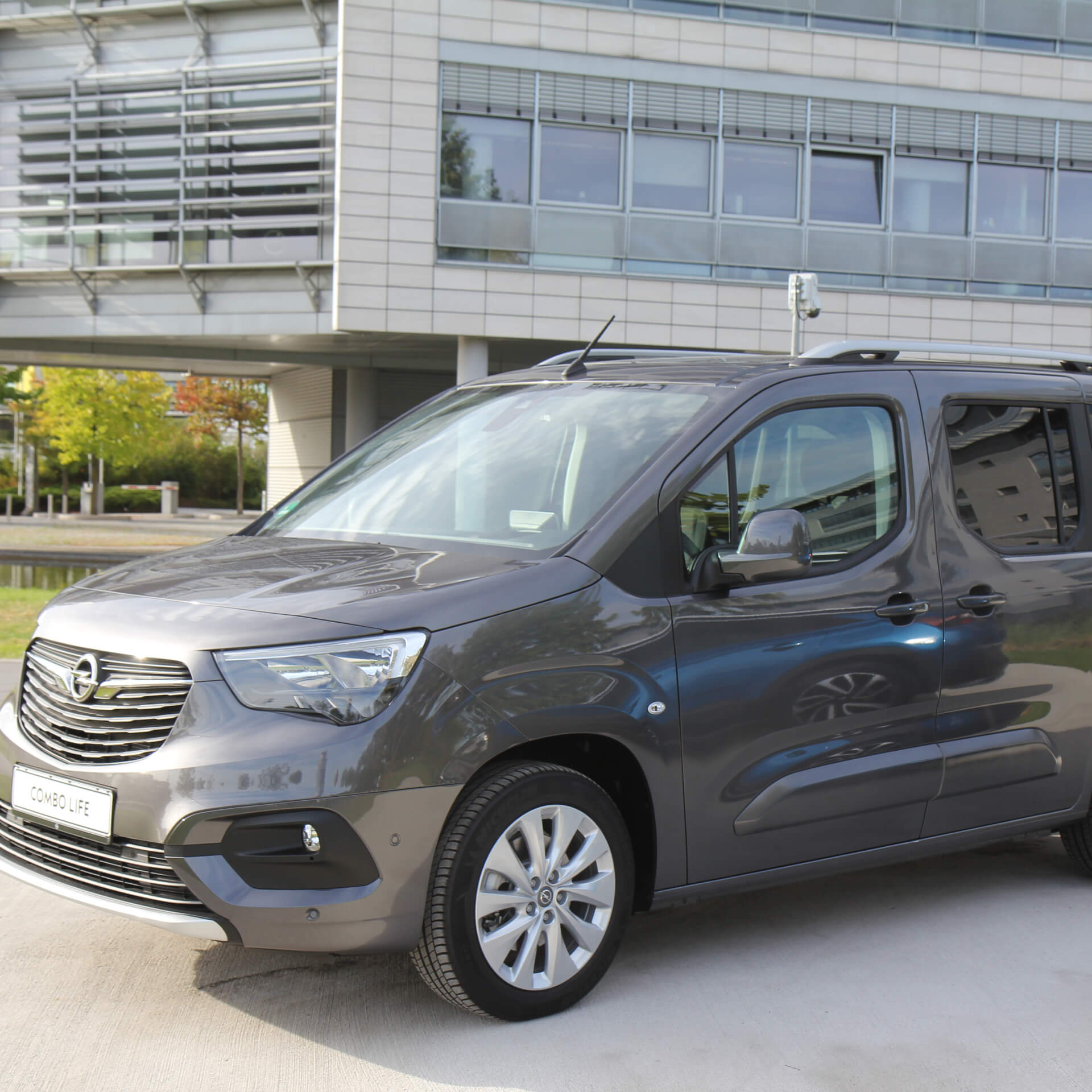 Direct4x4 accessories for Vauxhall Combo vehicles with a photo of a grey Vauxhall Combo parked outside a office building