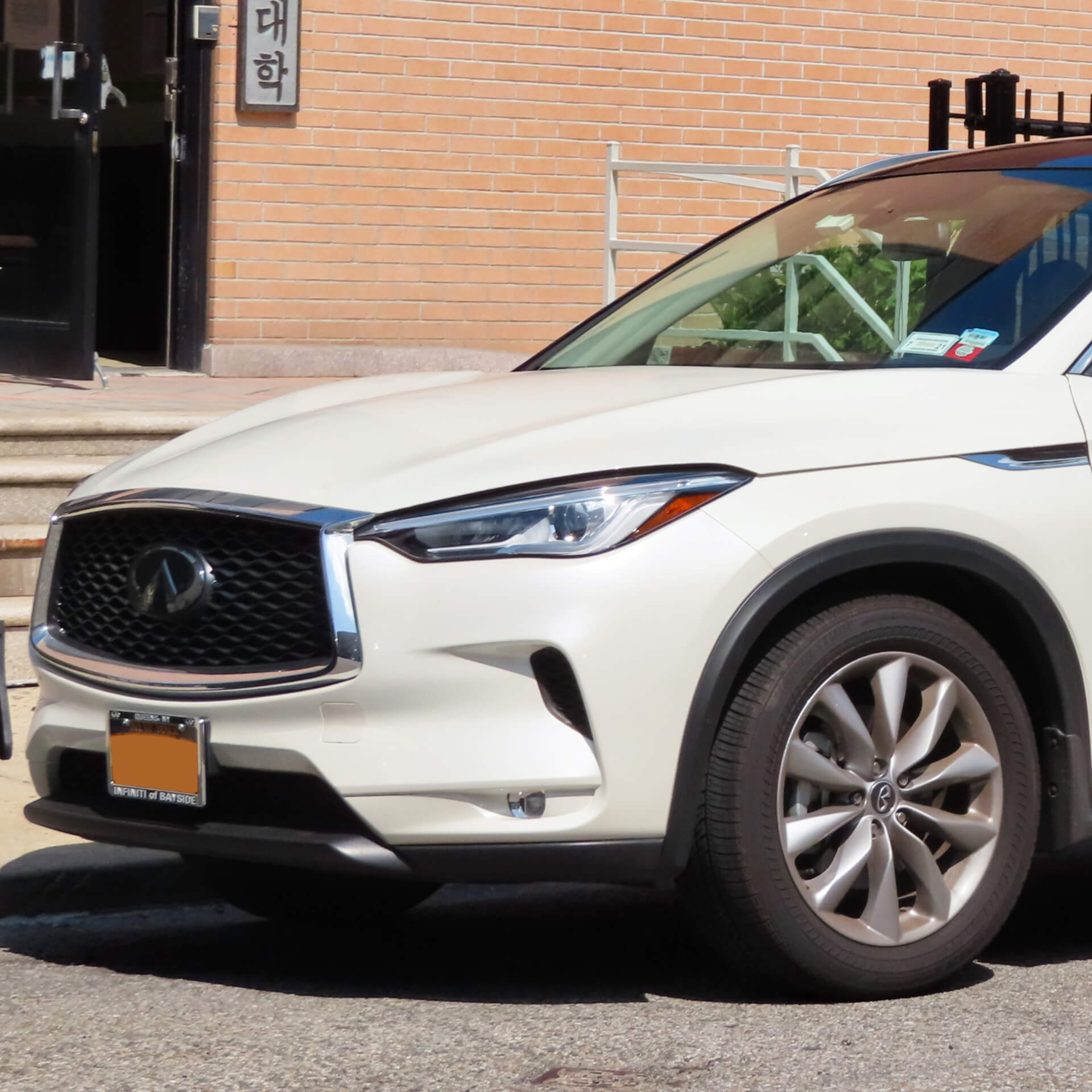 Direct4x4 accessories for Infiniti QX50 vehicles with a photo of the front of a white Infiniti QX50 parked on the street
