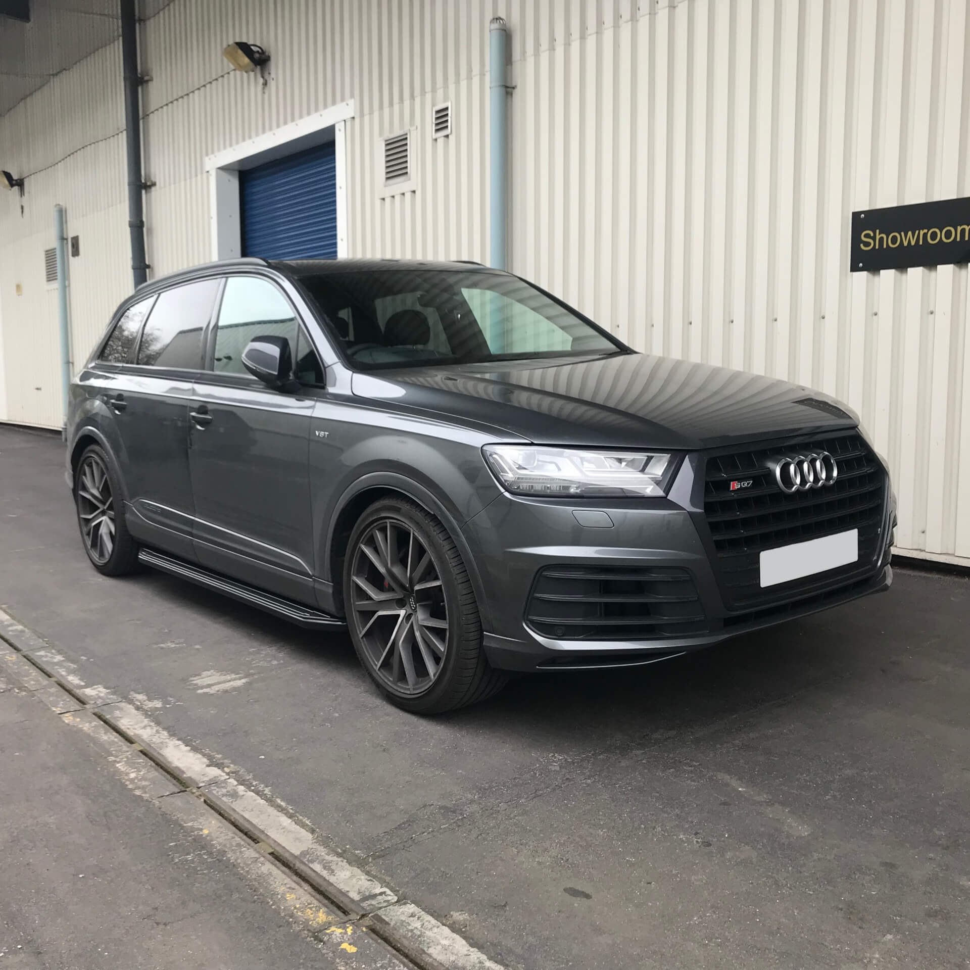 Direct4x4 accessories for Audi Q7 vehicles with a photo of a dark grey Q7 outside our showroom
