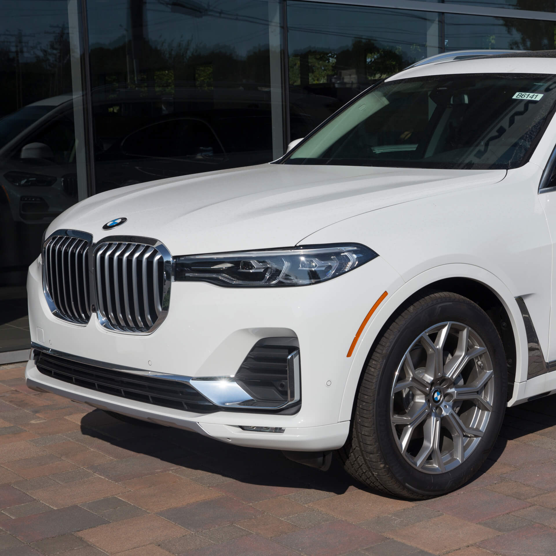 Direct4x4 accessories for BMW X7 vehicles with a photo of the front of a white BMW X7