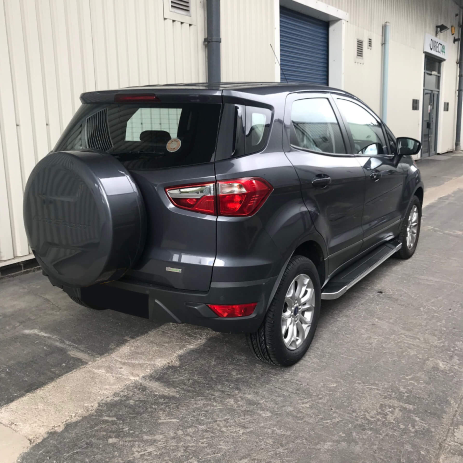 Direct4x4 accessories for Ford Ecosport vehicles with a photo the back of a dark grey Ford Ecosport outside our depot