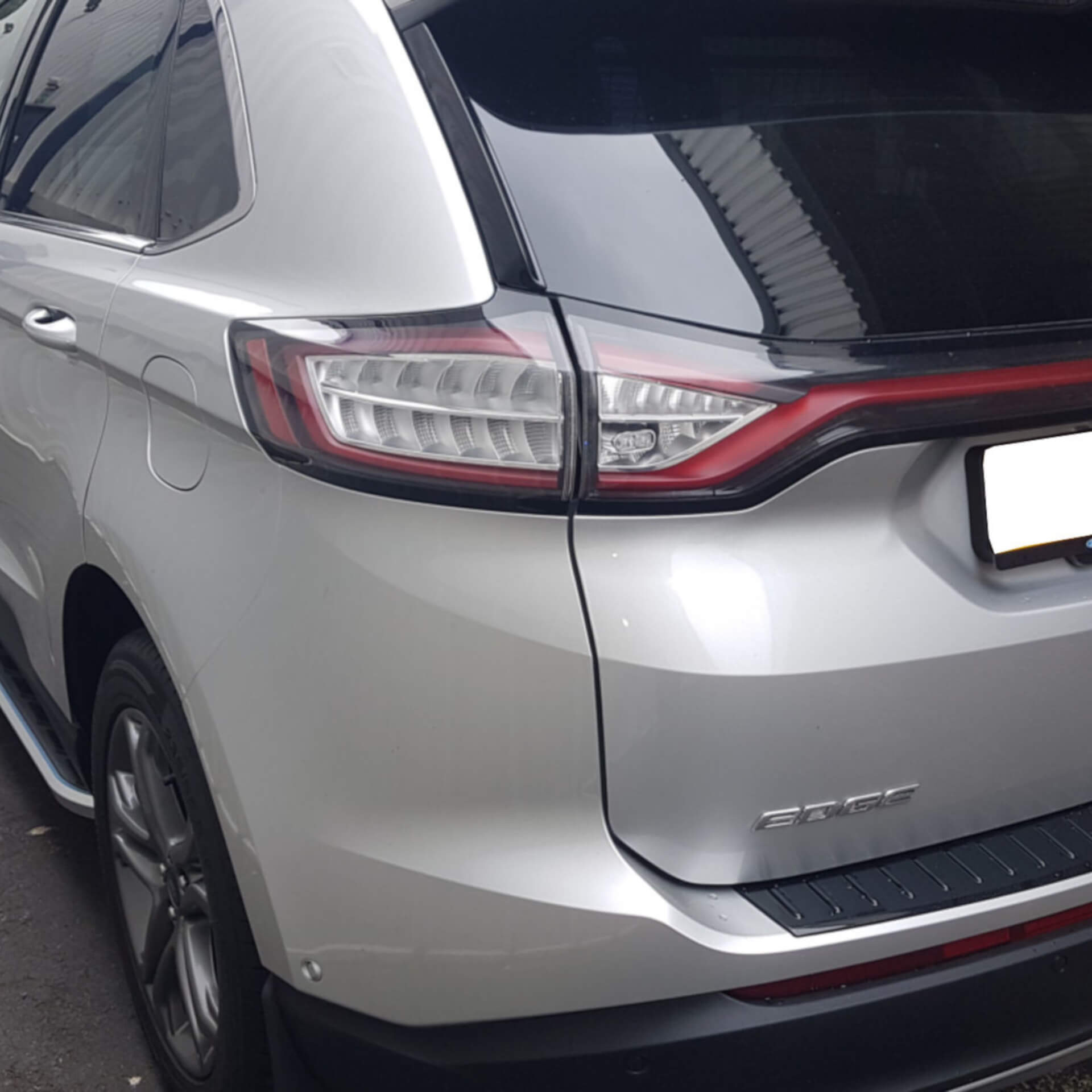 Direct4x4 accessories for Ford Edge vehicles with a photo of of a silver Ford Edge fitted with our Monsoon side steps outside our office