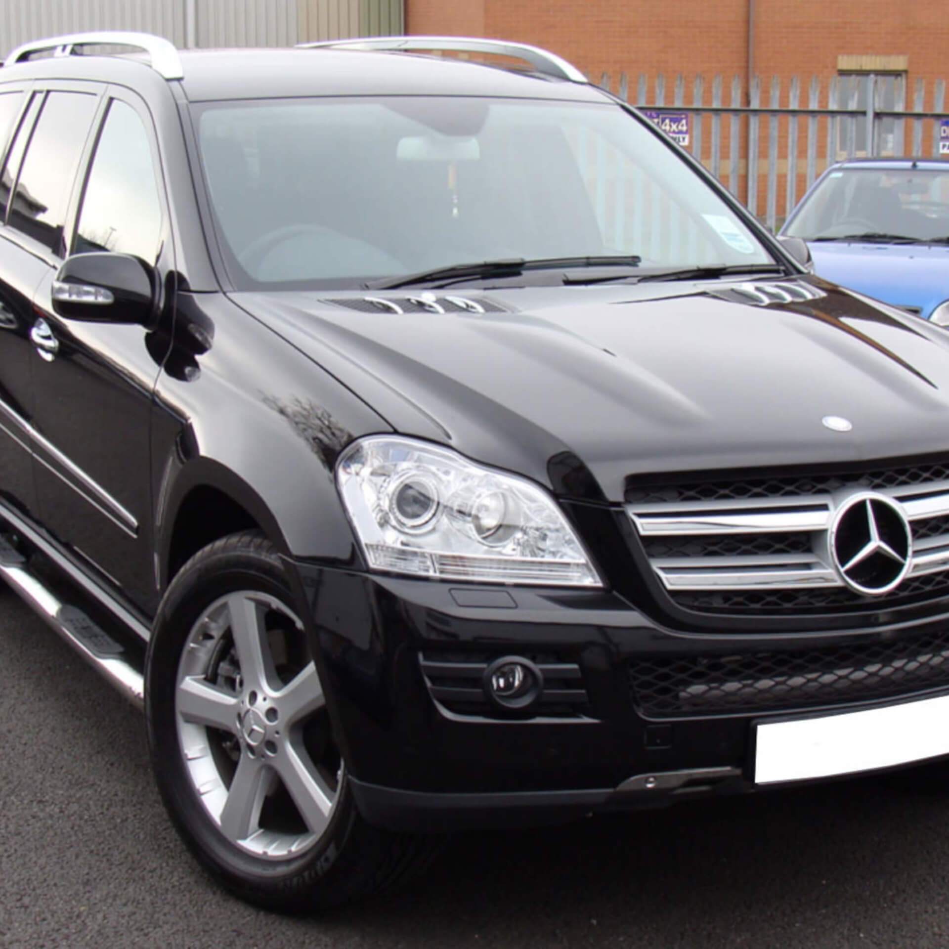 Direct4x4 accessories for Mercedes GL vehicles with a photo of a black Mercedes GL parked in a car park