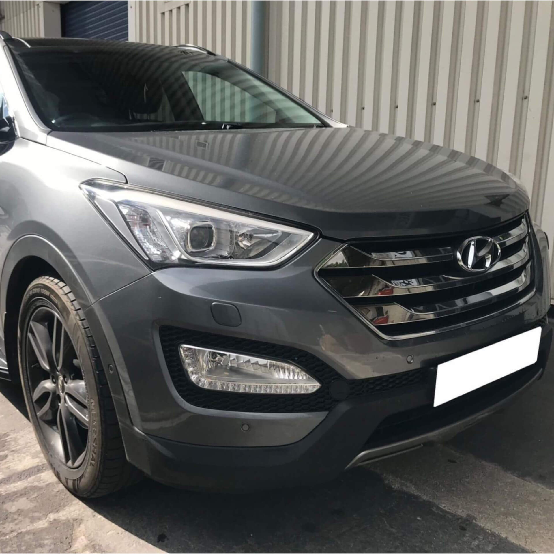 Direct4x4 accessories for Hyundai Santa Fe vehicles with a photo of a grey Hyundai Santa Fe outside our offices