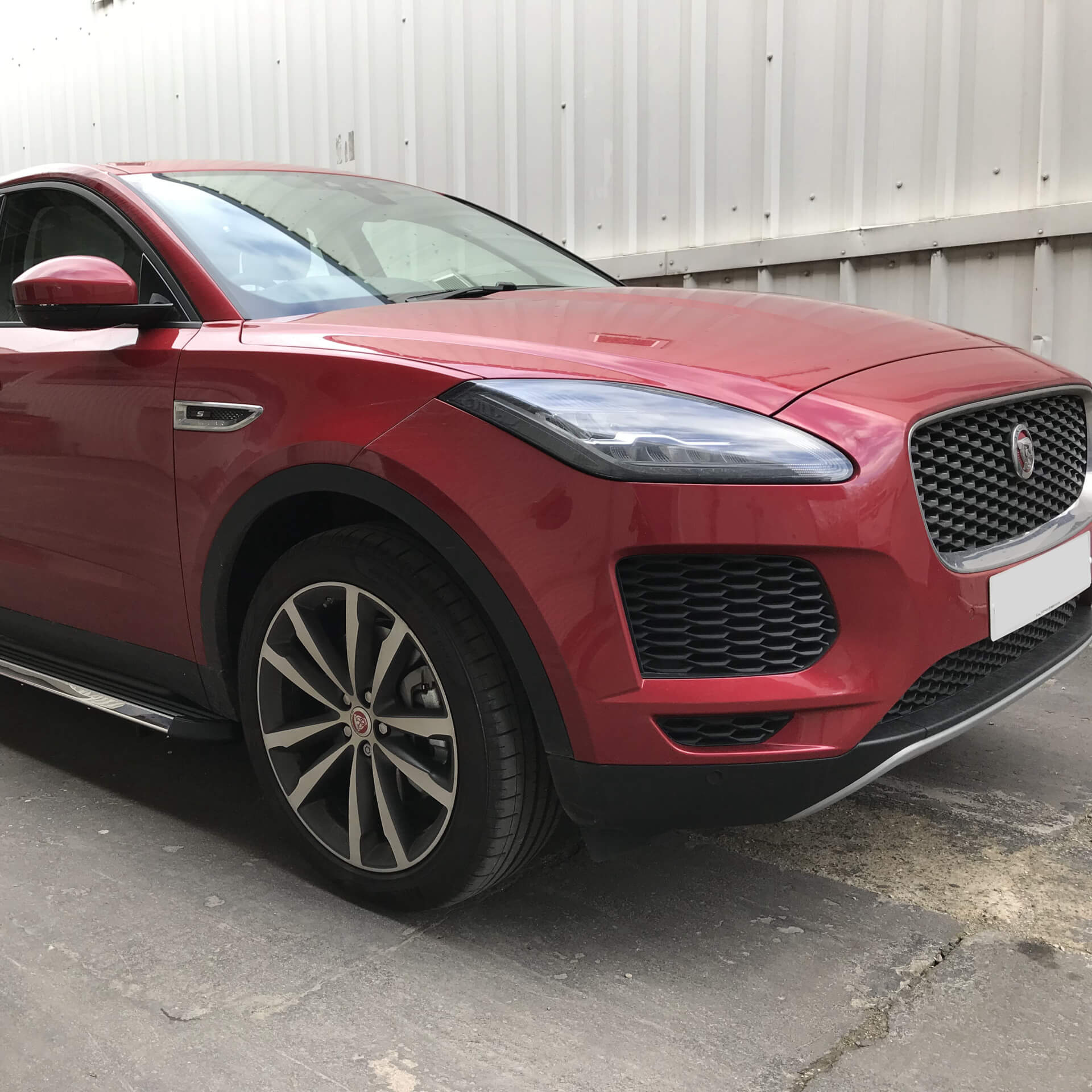 Direct4x4 accessories for Jaguar E-Pace vehicles with a photo of the front of a red Jaguar E-Pace outside our offices