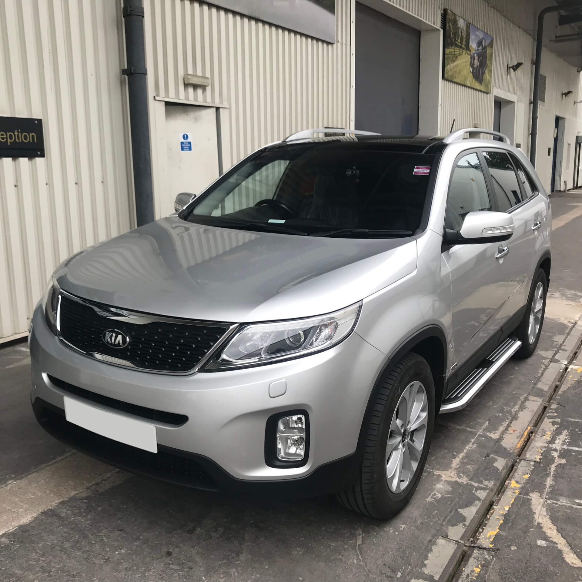 Direct4x4 accessories for Kia Sorento vehicles with a photo of a silver Kia Sorento parked outside our office with our premier side steps fitted