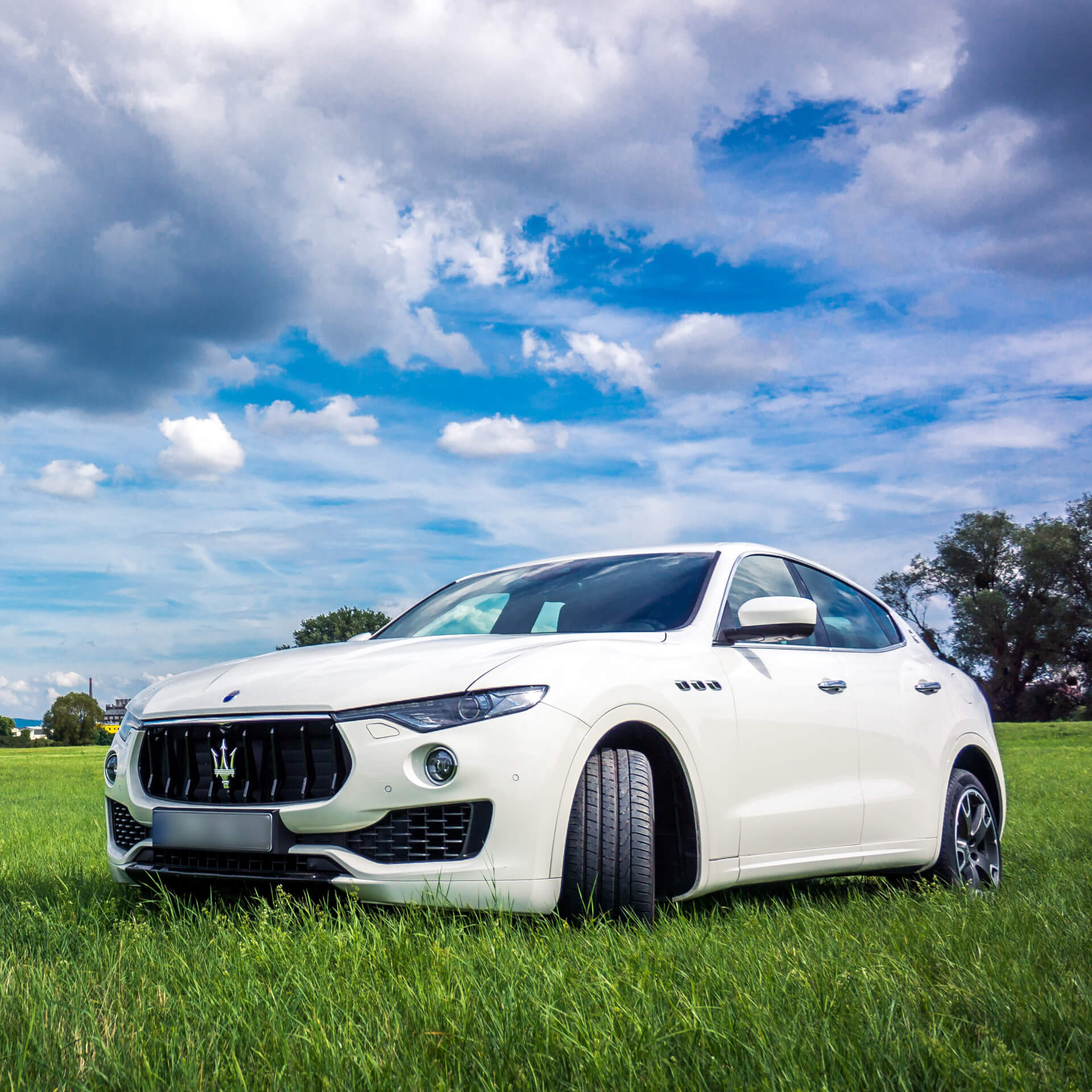Direct4x4 accessories for Maserati Levante vehicles with a photo of a white Maserati Levante parked in a field under a blue sky