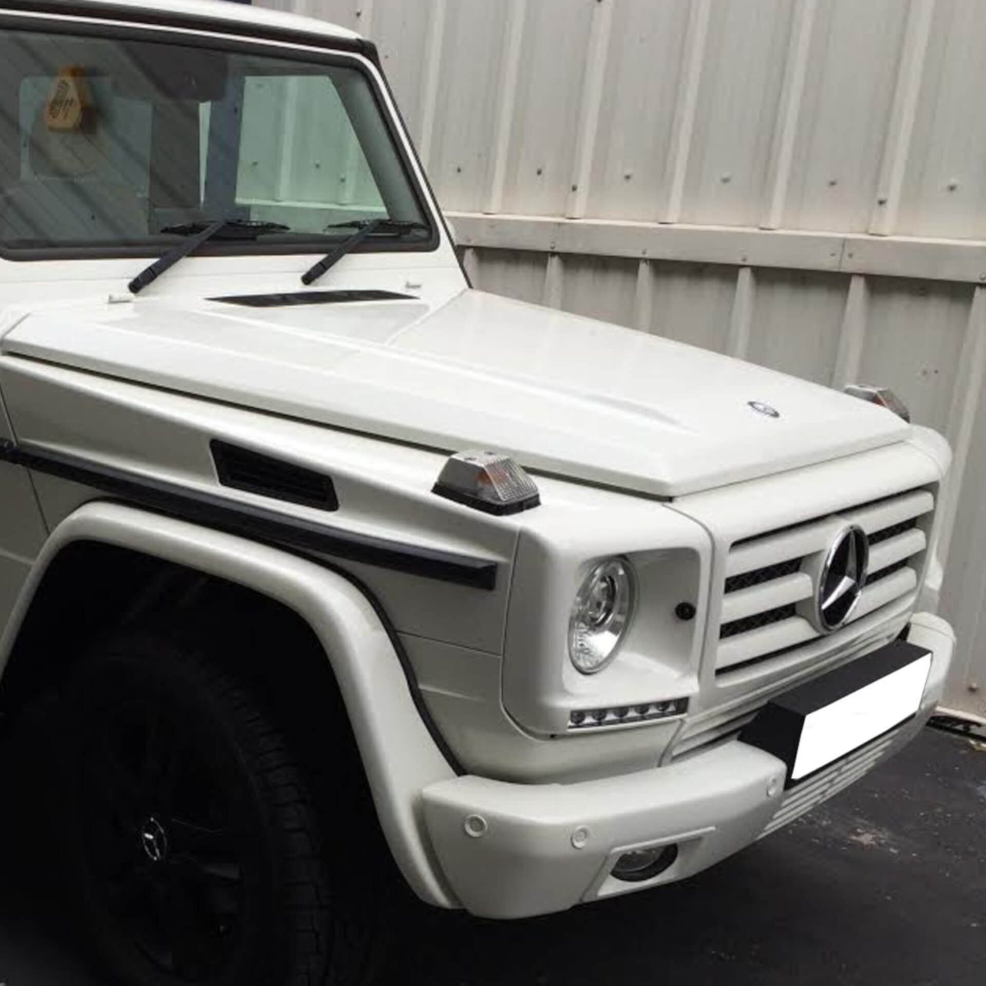 Direct4x4 accessories for Mercedes G-Class/G-Wagen vehicles with a photo of the front of a white Mercedes G-Wagen at our Derby depot