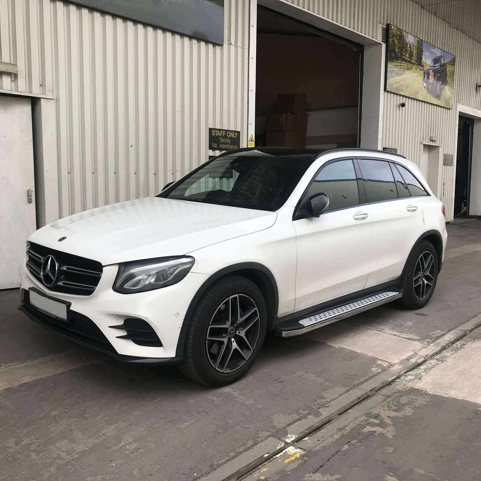 Direct4x4 accessories for Mercedes GLC vehicles with a photo of a white Mercedes GLC parked outside our depot fitted with Freedom style side steps
