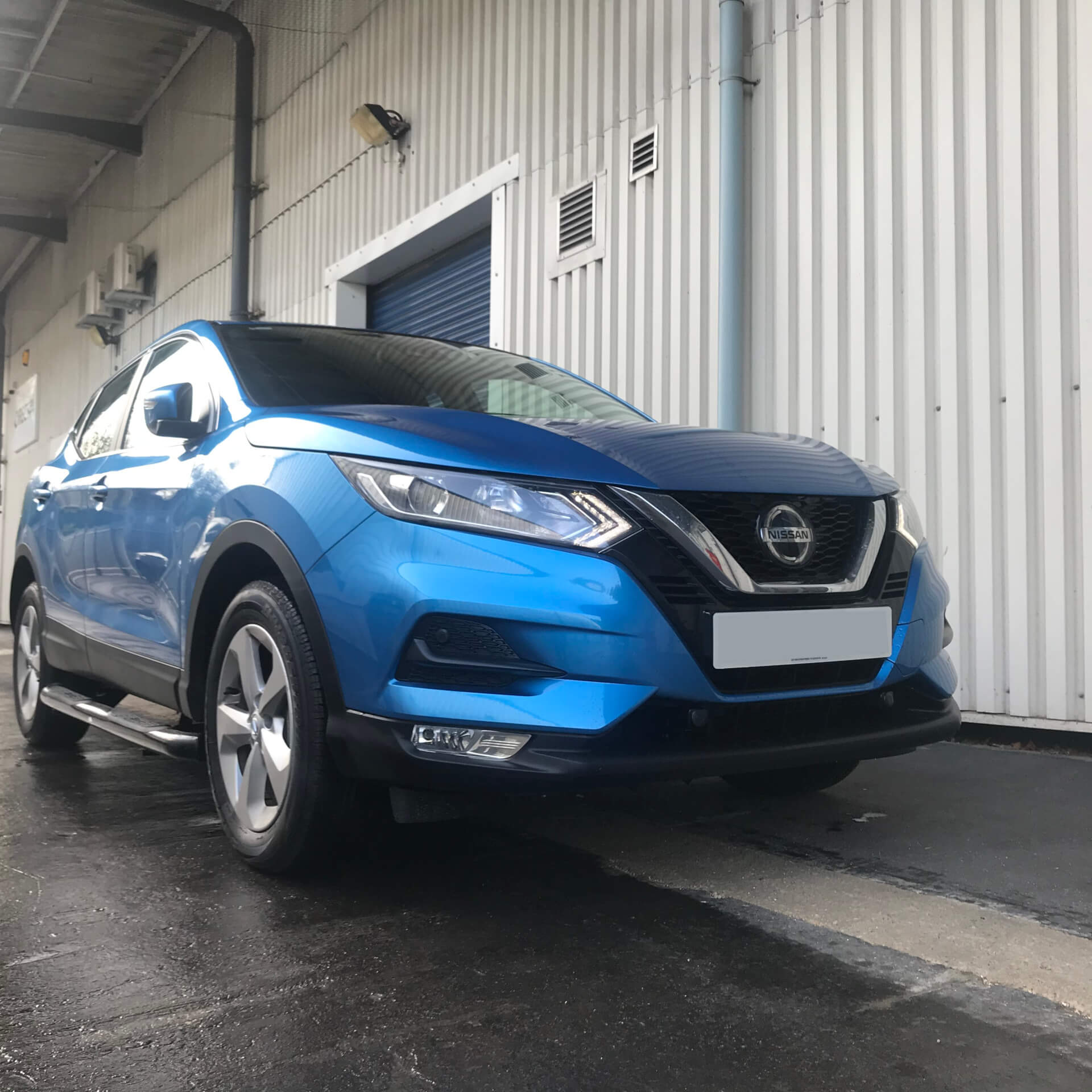 Direct4x4 accessories for Nissan Qashqai vehicles with a photo of a blue Nissan Qashqai parked outside our offices
