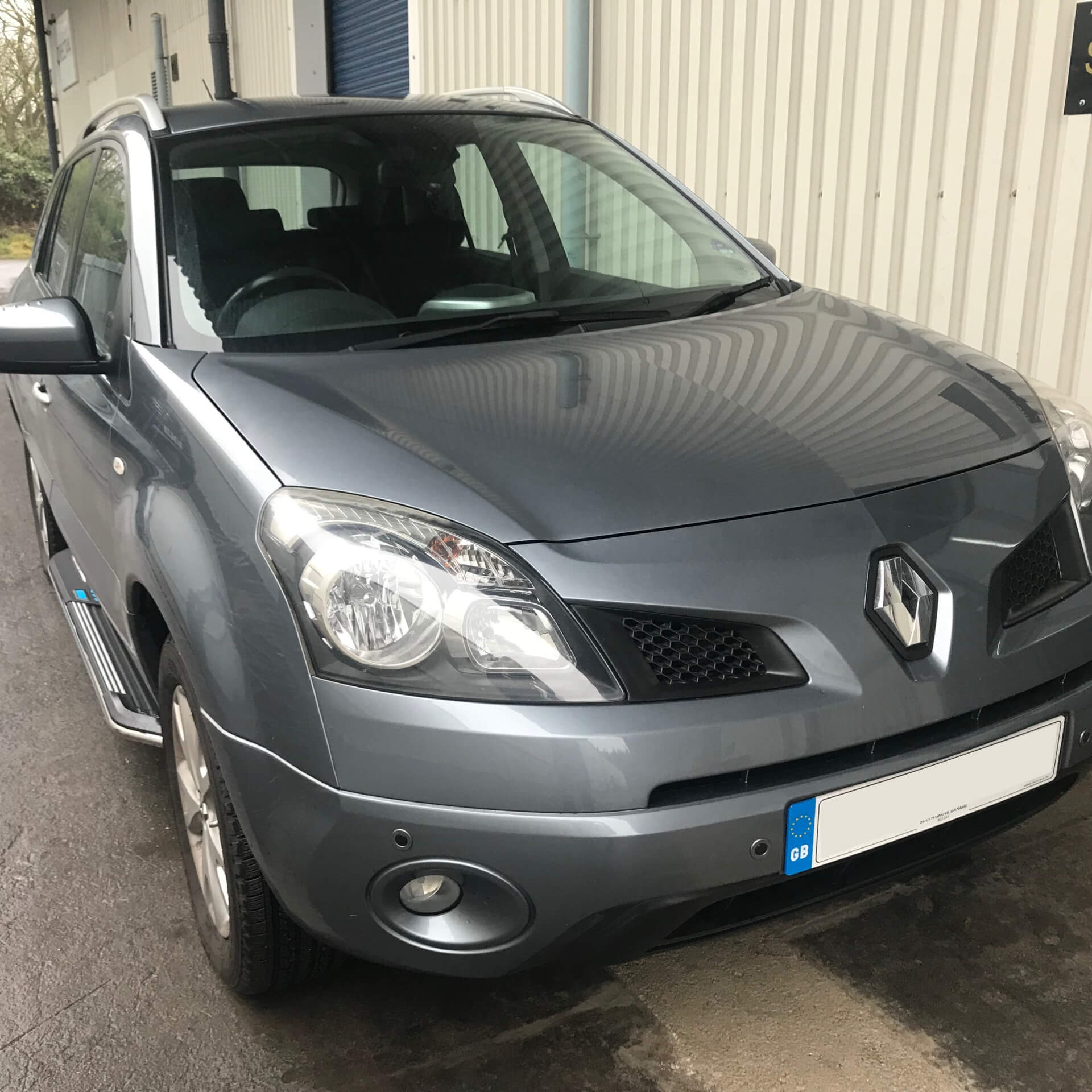 Direct4x4 accessories for Renault Koleos vehicles with a photo of a grey Renault Koleos fitted with side steps outside our depot