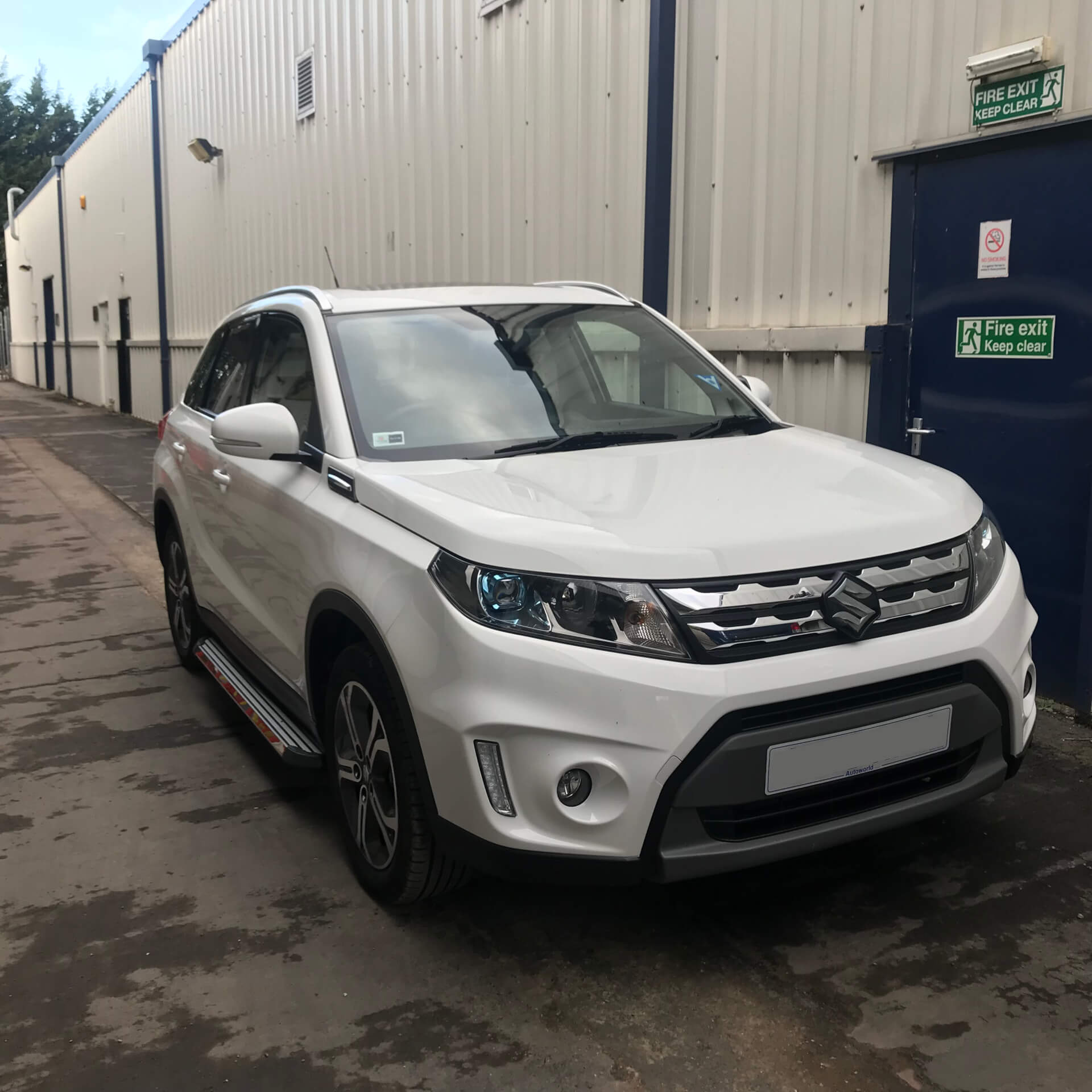 Direct4x4 accessories for Suzuki Vitara vehicles with a photo of a white Suzuki Vitara outside out depot fitted with Stingray style side steps
