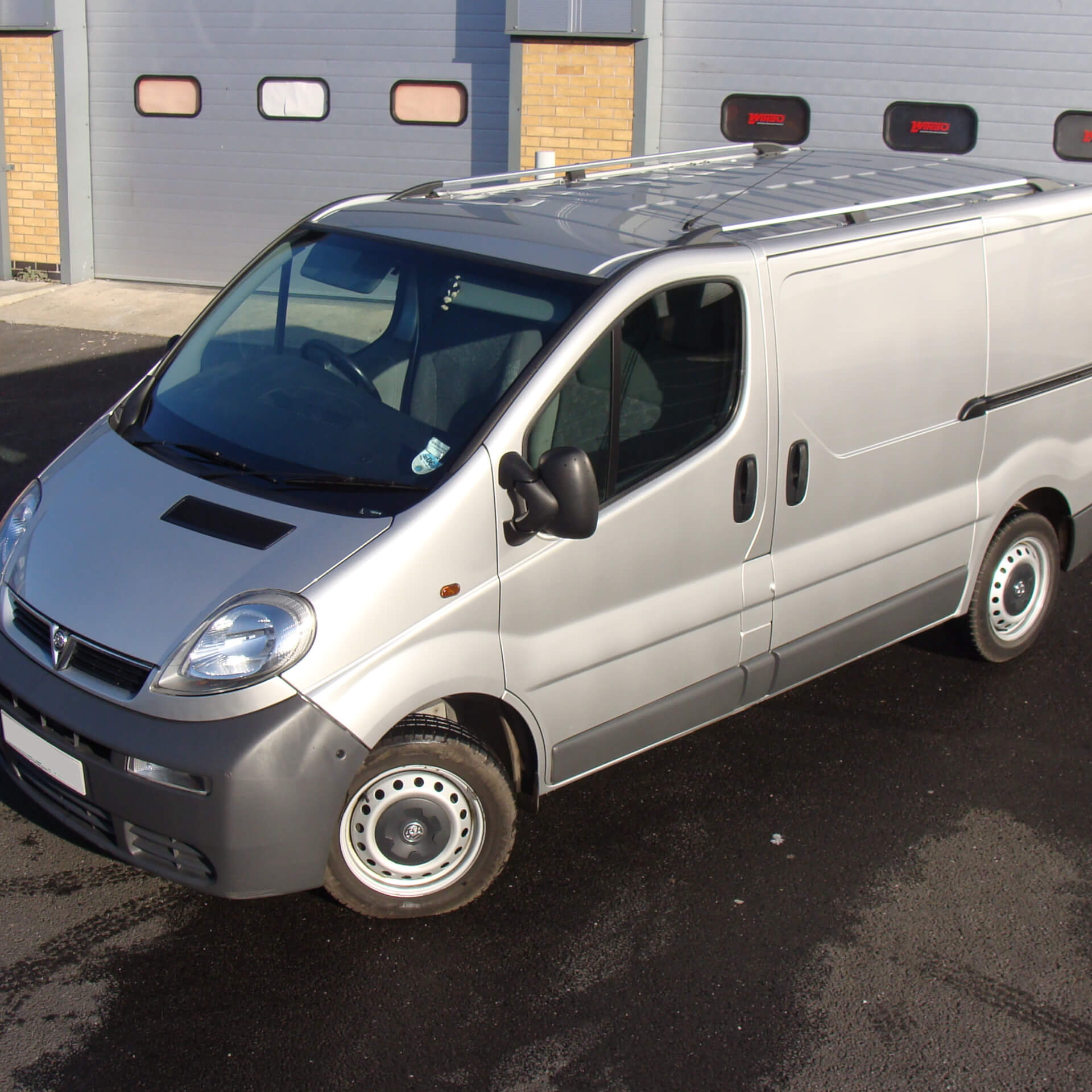 Direct4x4 accessories for Vauxhall Vivaro vehicles with a photo of a silver Vauxhall Vivaro parked outside of a industrial unit