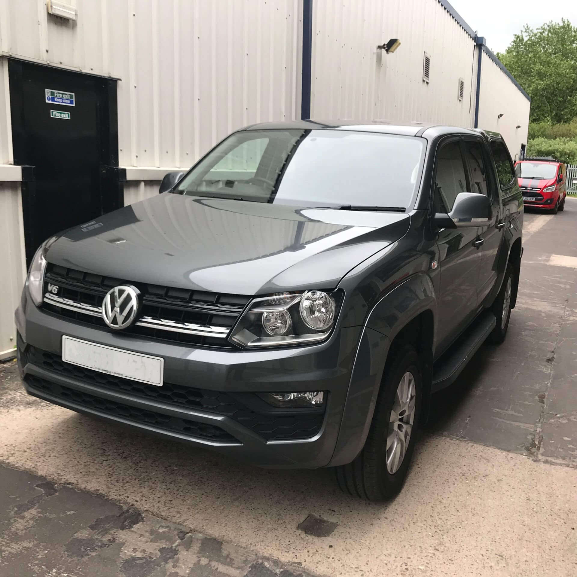 Direct4x4 accessories for Volkswagen Amarok vehicles with a photo of a grey volkswagen amarok in front of a industrial unit