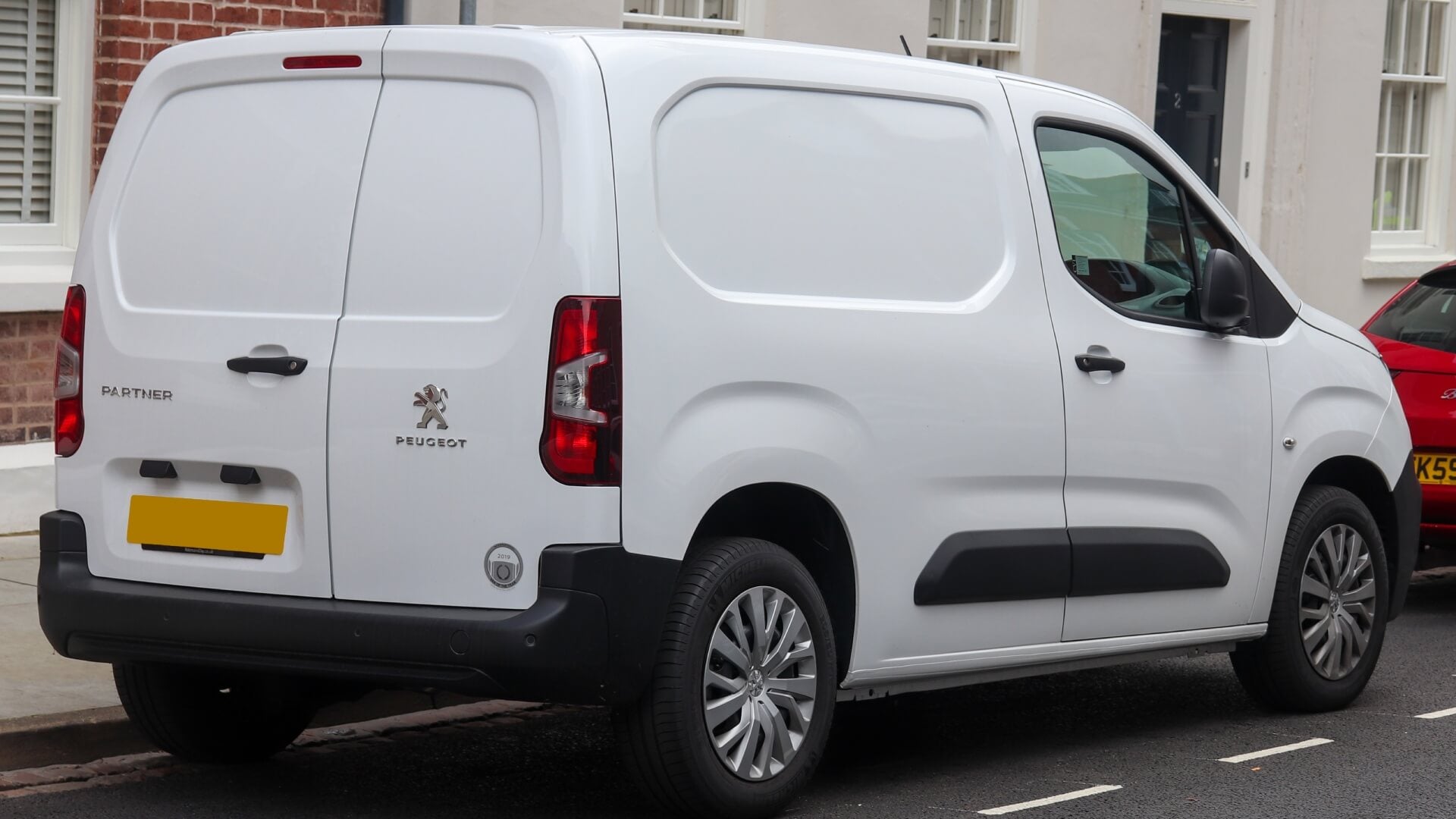 Photo of a white 2019 Peugeot Partner van  parked on a UK side street