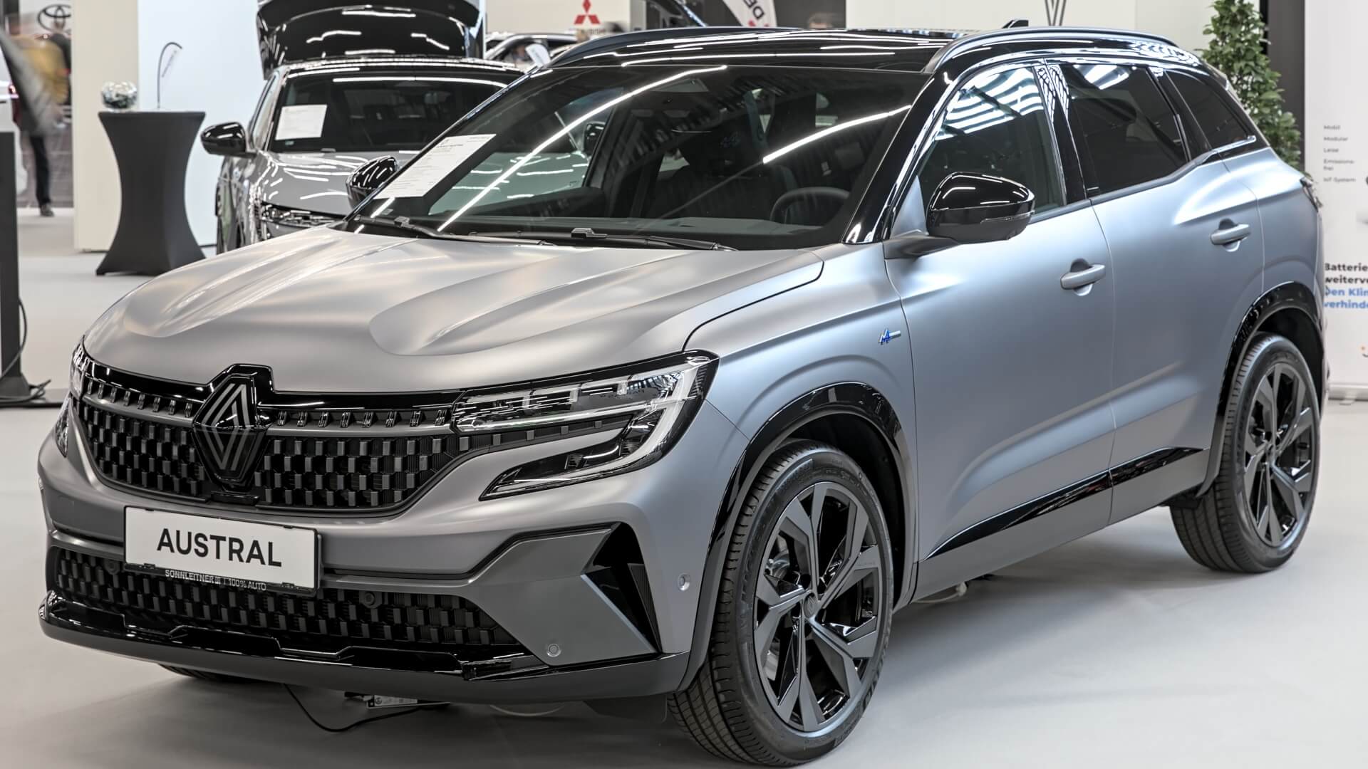 Photo of a brand new Renault Austral 2025 in dark grey parked in the showroom