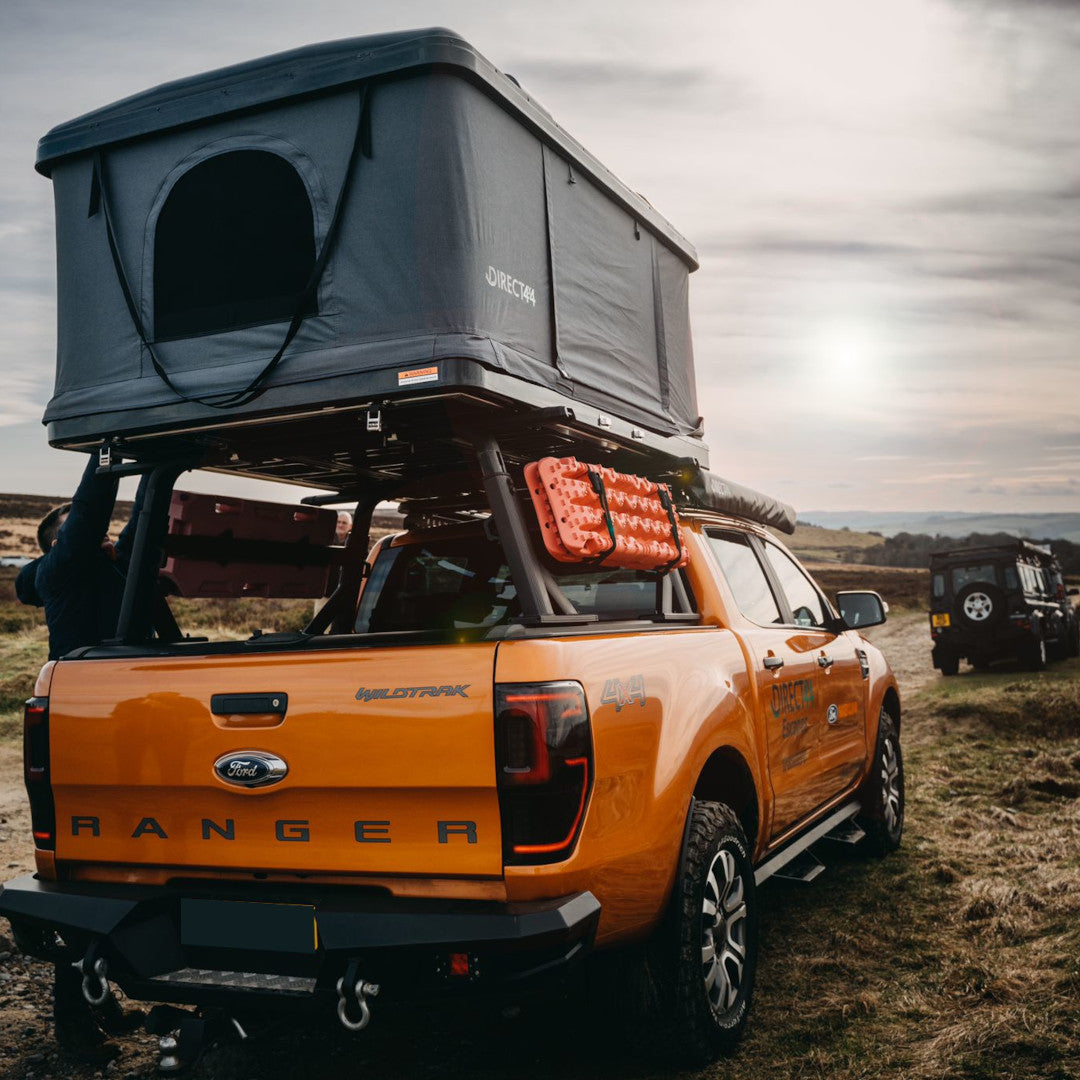 Orange Ford Ranger Wildrak with Direct4x4 roof top camping tent and other expedition overland gear taken while green laning in the Peak District.