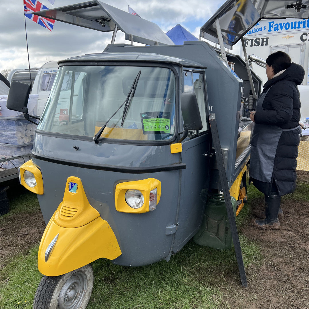 Photo of a Piaggio coffee shop at the Stratford-Upon-Avon Adventure Overland Show in April 2023.