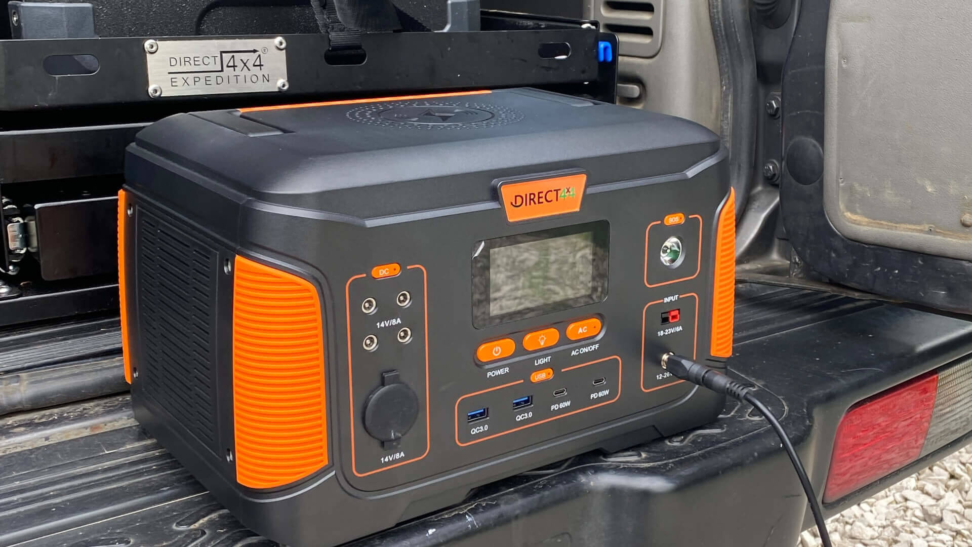Photo of a Direct4x4 multifunction outdoor power charging station on the back of an offroad 4x4 vehicle.