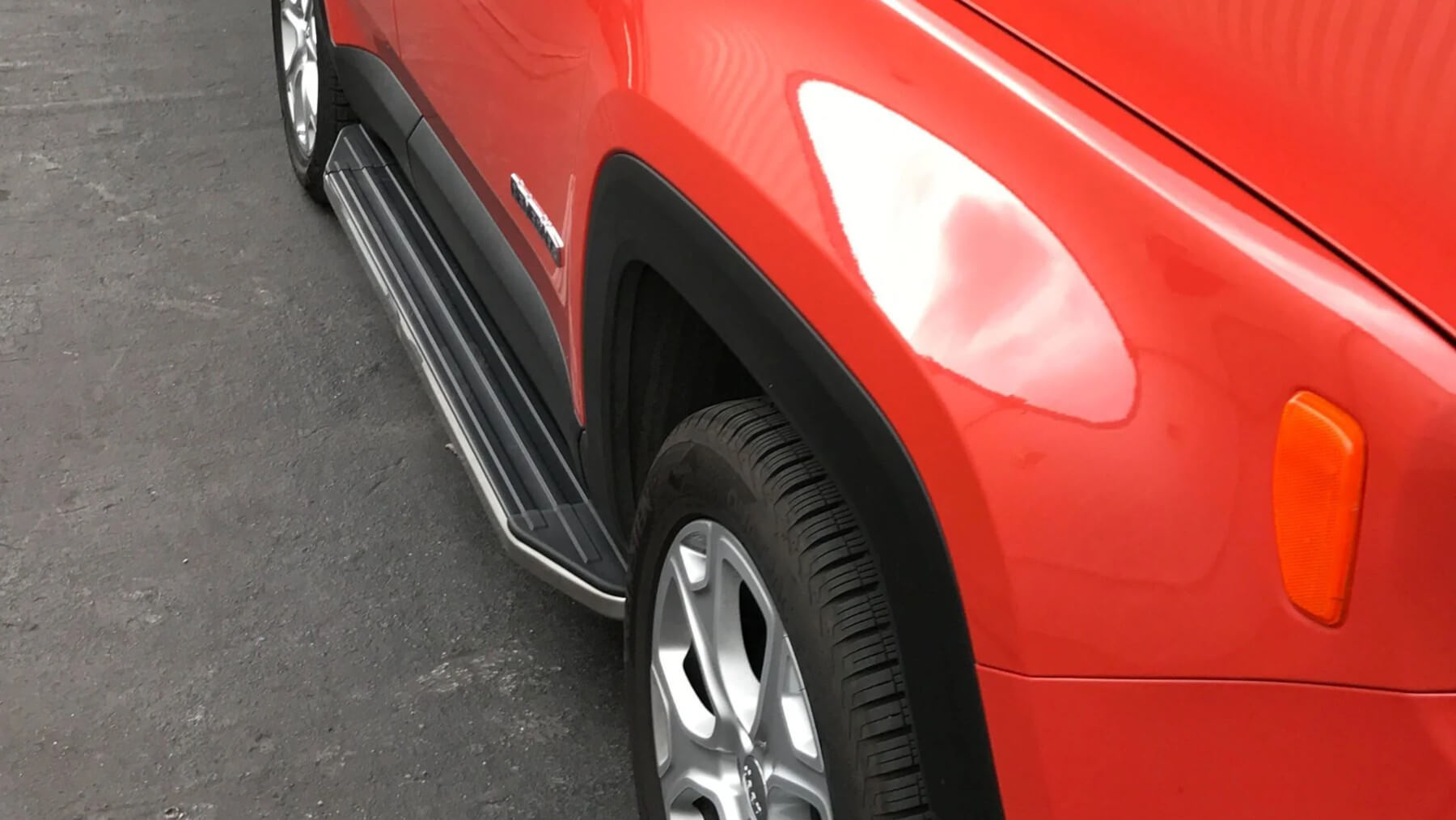 Direct4x4 side steps, side bars and running boards with a close up photo of a red car.
