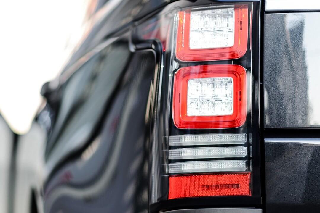 Direct4x4 accessories with a close up photo of a stylish luxury black Range Rover SUV